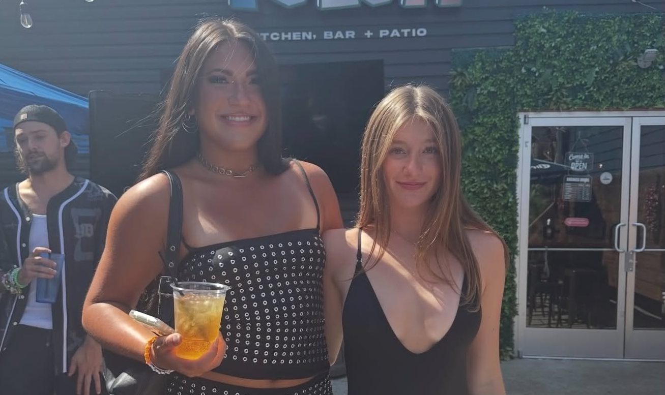 Guests outside the Tulum entrance sign