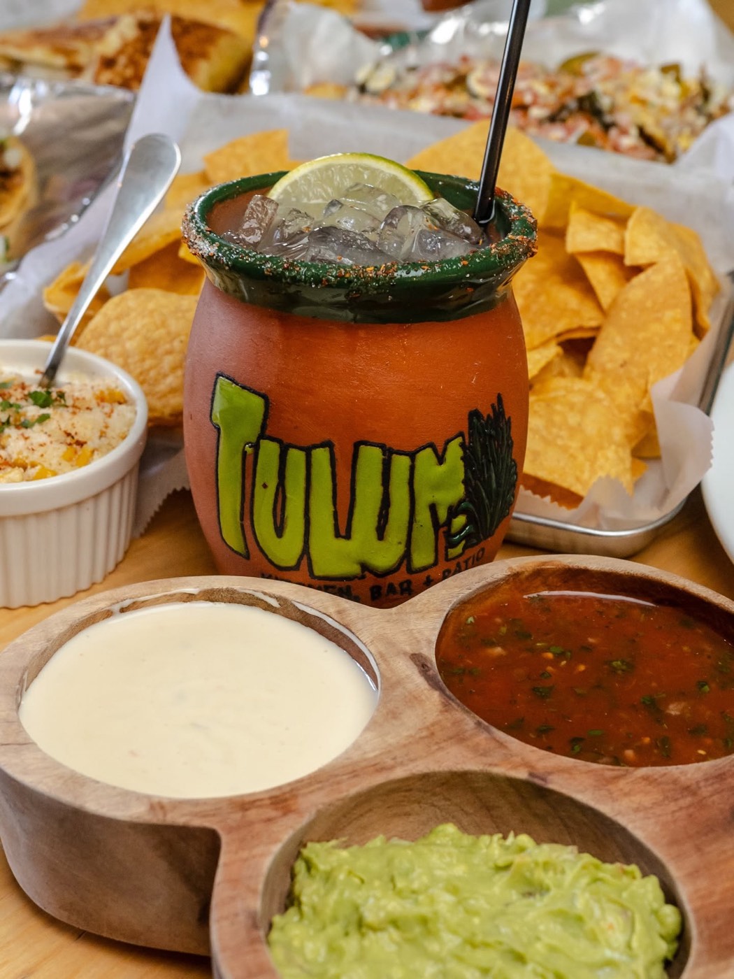 Chili-salt rimmed margarita in a hand-painted Tulum clay cup